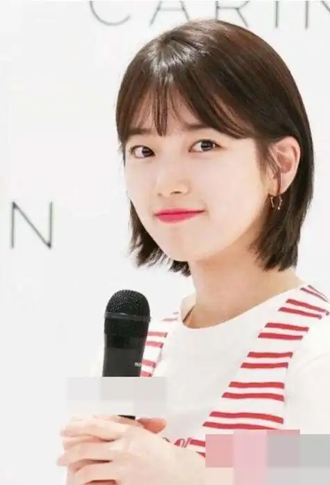 圆脸女生剪什么刘海好看有靓度 向你招手的短卷烫头发被俘虏住_发型