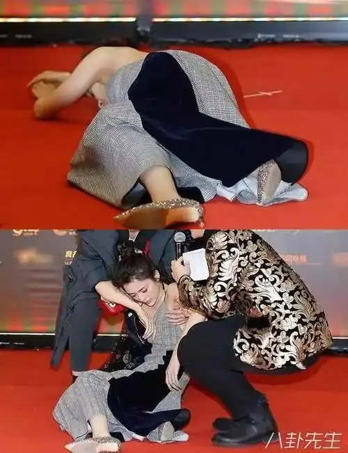 晕倒在地,工作人员连忙把她扶走▼赵丽颖一边回答主持人问题一边微微