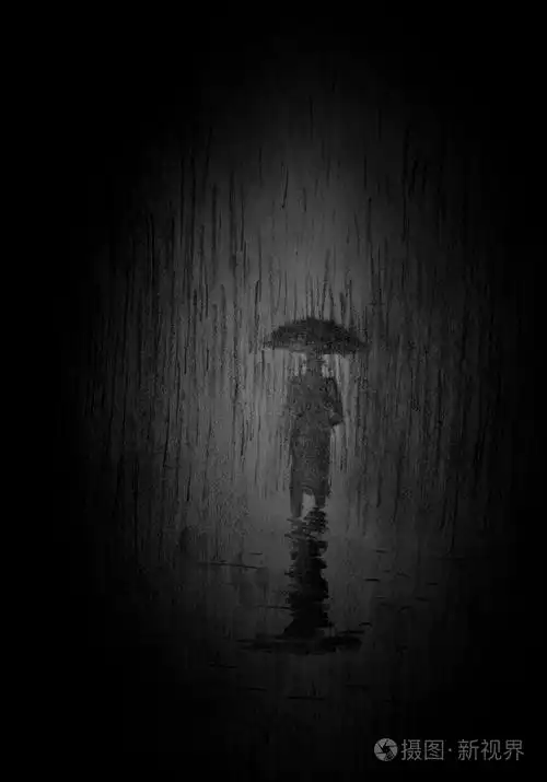 一把伞在雨中的男人