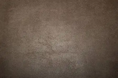 纯暗色调深棕色灰色面料的背景与粗糙照片