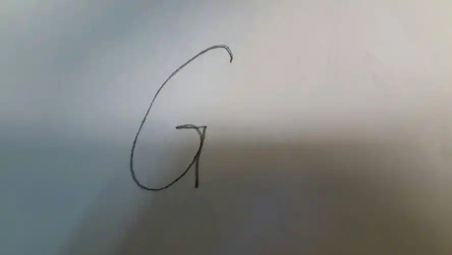 大写英文g怎么写,写完拍照片?