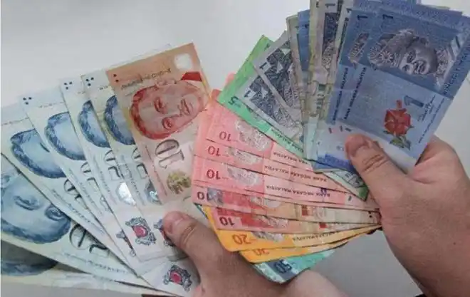 新加坡元兑令吉汇率创下历史新高大批狮城客排长龙兑换越堤消费