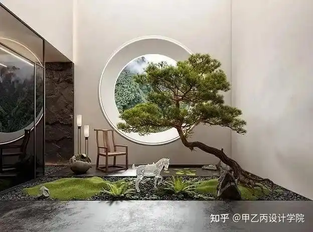 水景取团圆和谐圆满之意圆形跌水是室内会客厅对外的视觉焦点将鱼池中