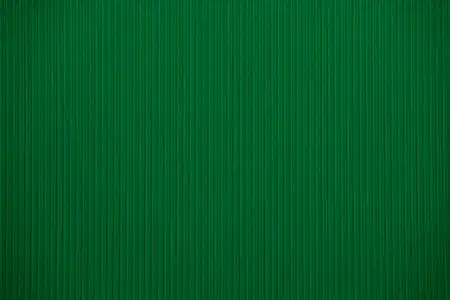 深绿色的彩色瓦楞纸板纹理作为背景有用照片