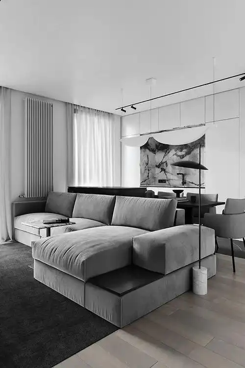 客厅的黑白灰配色,奠定高度理性的空间基调,浅灰色大理石纹的电视墙