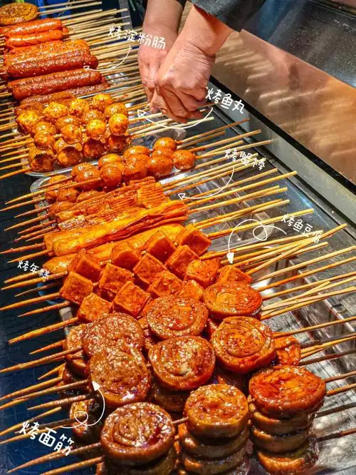 西安探店09裹满辣酱烤鱼饼烤年糕75夜宵坠爱