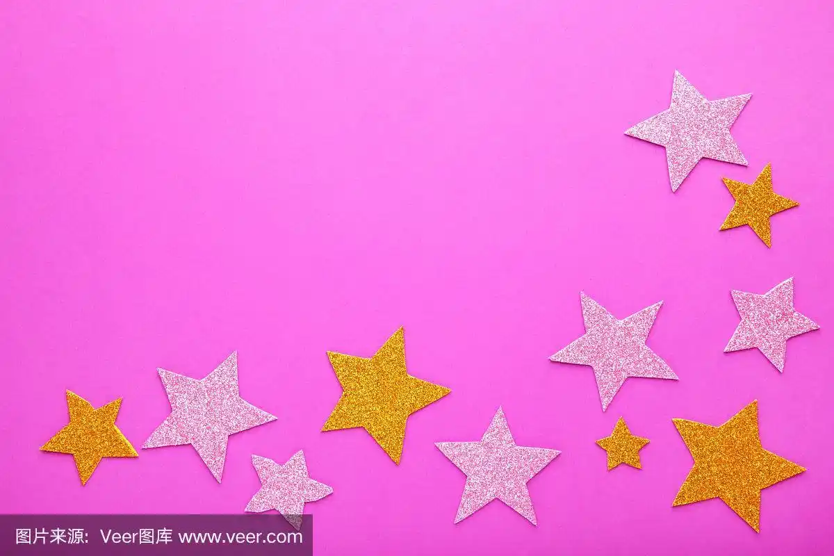 粉红色背景上闪烁着金色和粉红色的星星