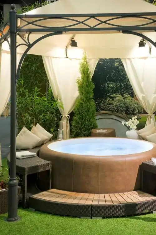 the cloth domed gazebo above the hot tub has