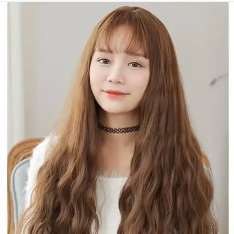 宽长脸女生烫小波浪卷发更显气质