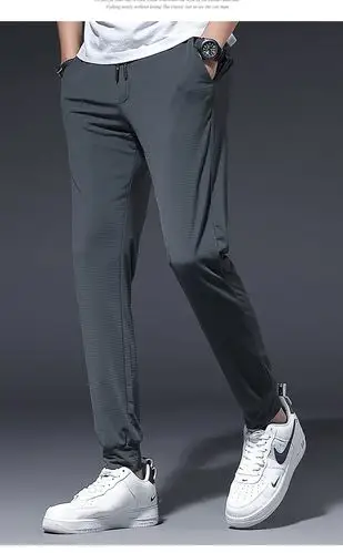 夏季薄款透气网眼冰丝休闲裤男装空调裤子男士小脚束脚运动户外