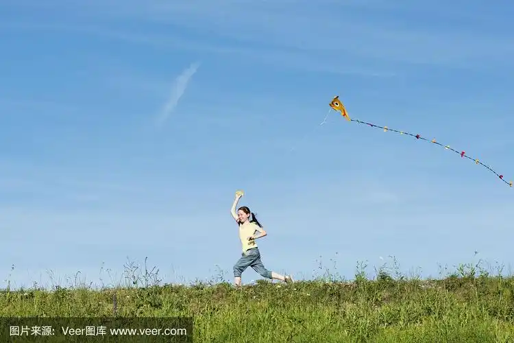 快乐的女孩在放风筝