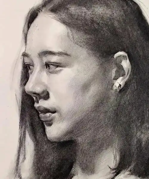 素描头像中长发侧颜女青年