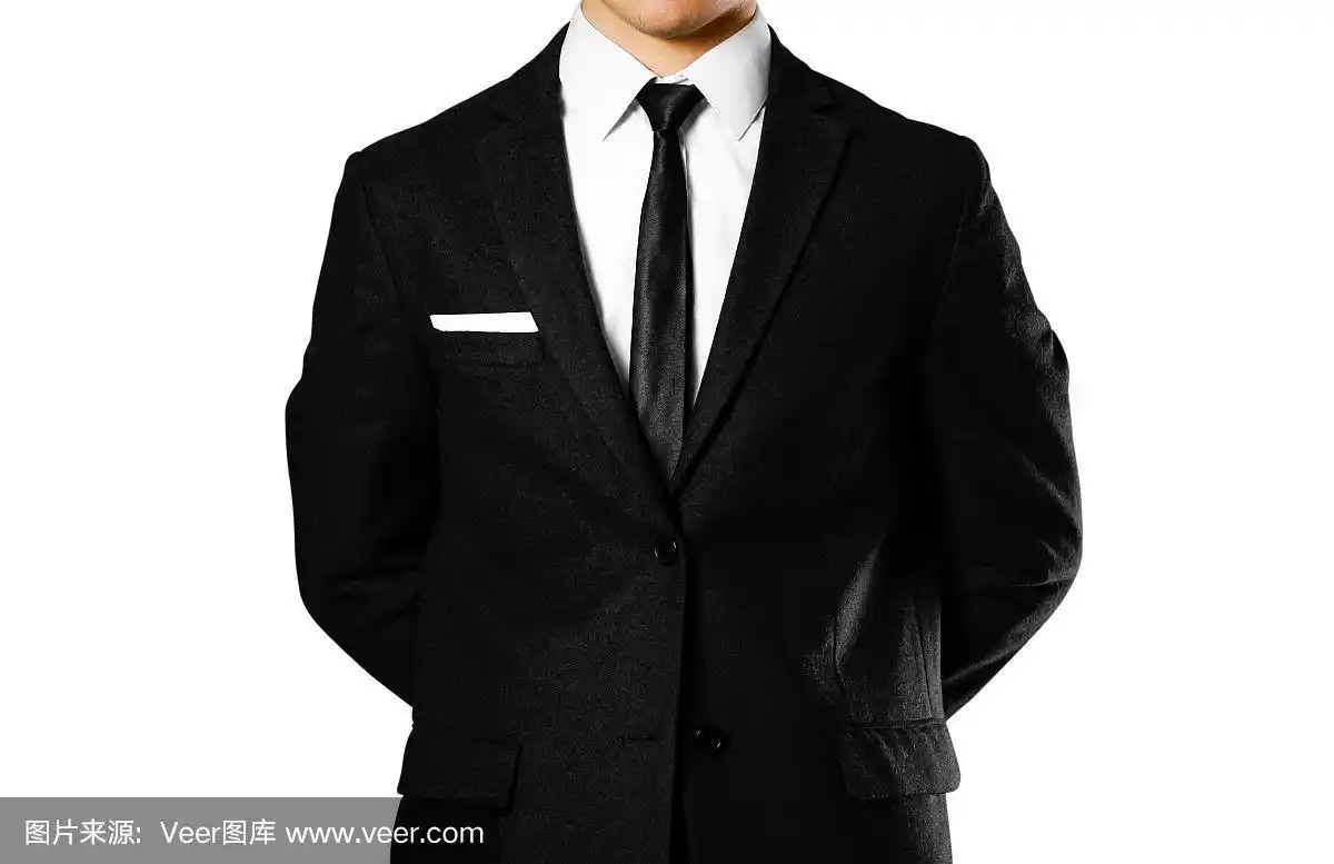 穿黑西装,白衬衫,打领带的商人.工作室拍摄.在白色背景上隔离