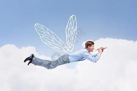 商人飞得很高轻的商人,长着翅膀天空中飞翔图片素材