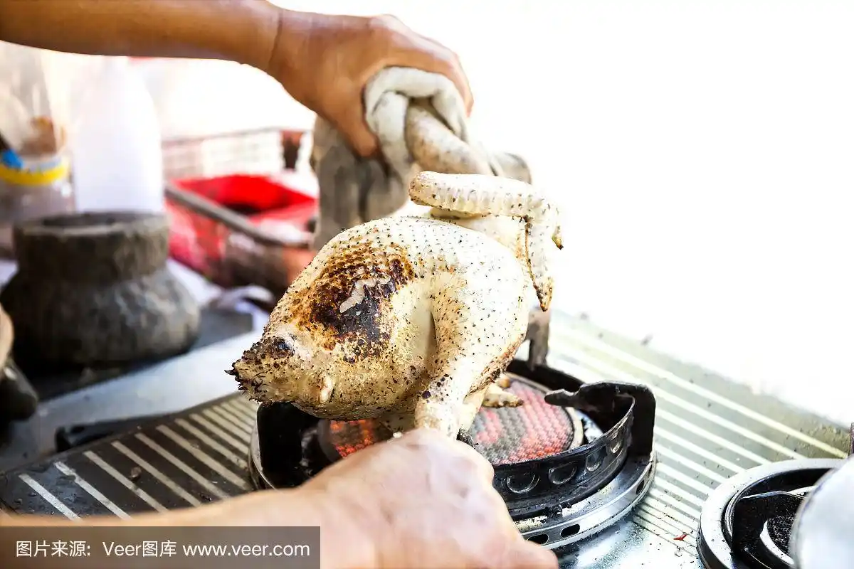 在煤气炉上拔鸡的毛