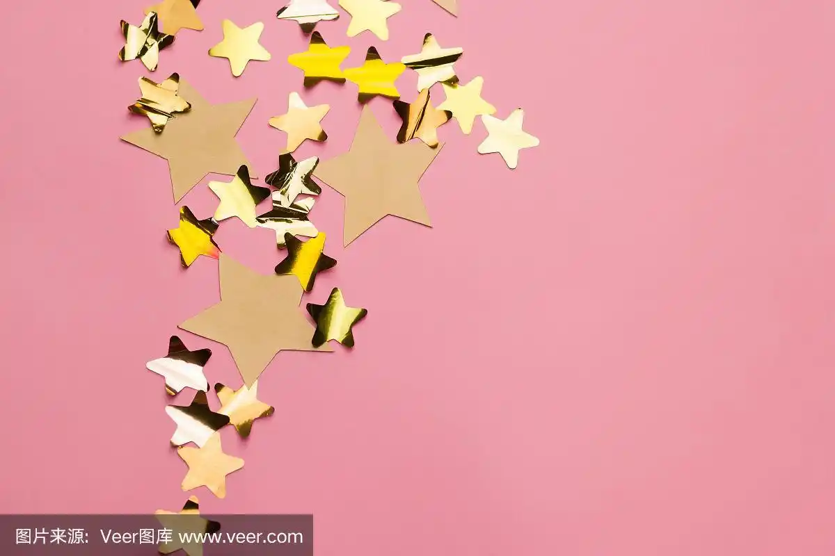 粉红色背景上的金色星星