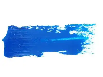 蓝色的污迹笔刷笔触孤立在白色背景上的油漆照片