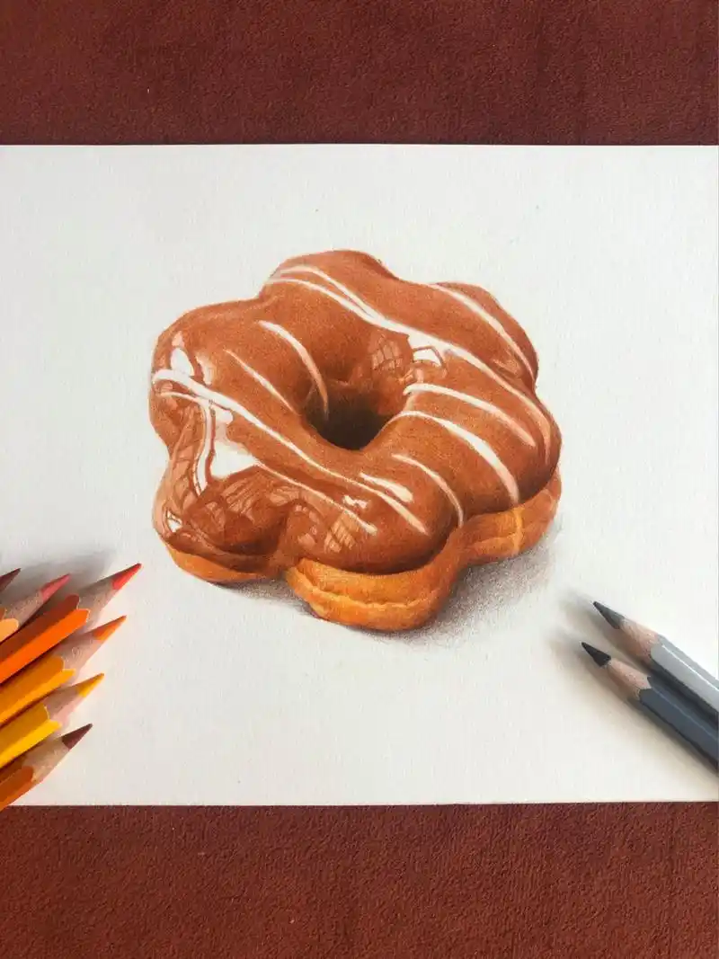 今天就和大家分享彩铅画甜甜圈的步骤 11566第一步:用铅笔轻轻