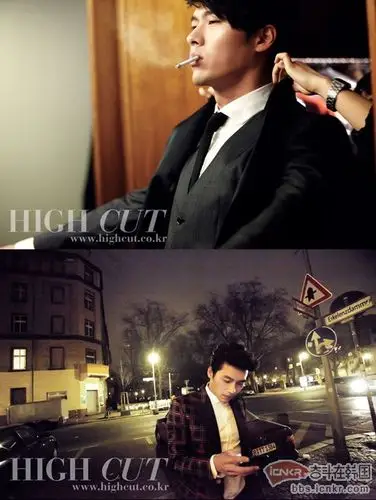 照片中,玄彬坐在镜子前整理衣领,嘴中叼着香烟,表情平静.