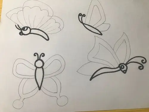 我们开始画小蝴蝶我们先画它的头身体还有触角还可以加上眼睛嘴巴