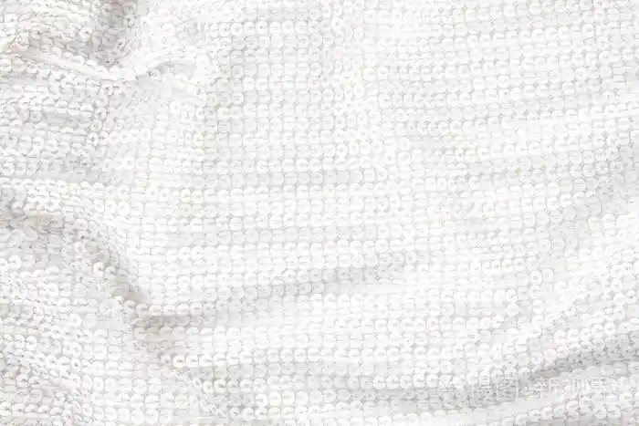 从白色闪亮亮片纺织的抽象背景