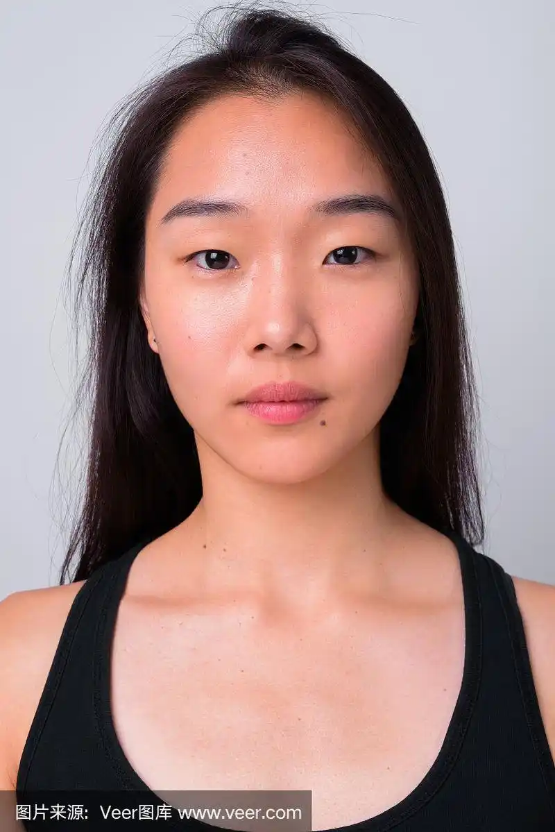 美丽的年轻中国女人的脸,白色的背景