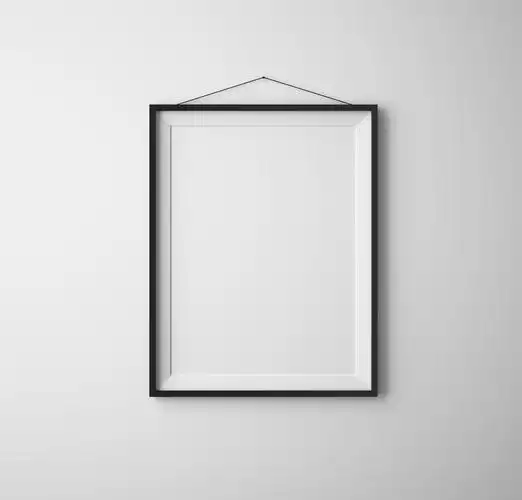 手持相框的人墙上白色的相框背景图片空白照片相框挂在墙上的工作场所