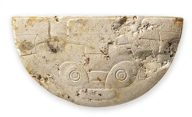 神人兽面纹玉璜良渚文化 神人兽面纹玉璜(局部)良渚文化玉器纹饰在