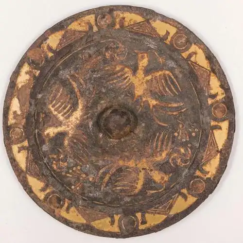 汉代环绕骑射人物铁镜.