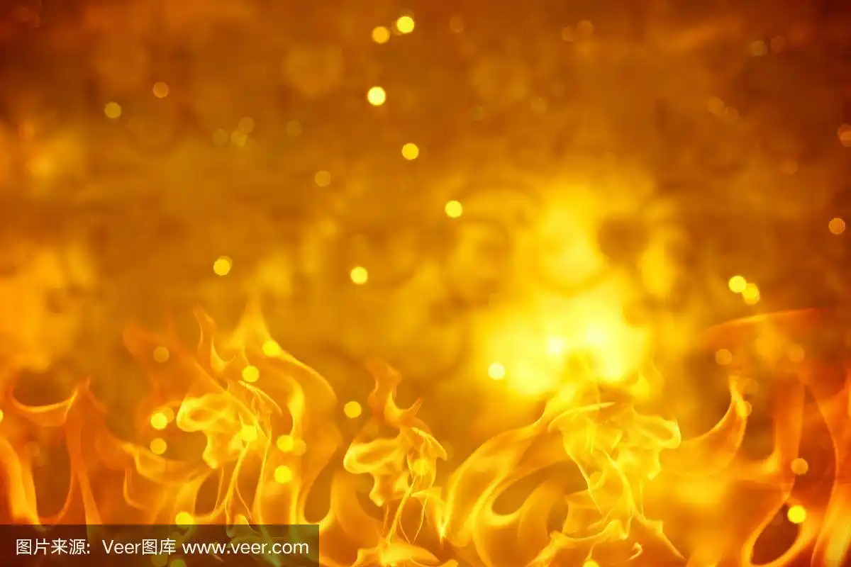 以火焰为背景的金色抽象散景.