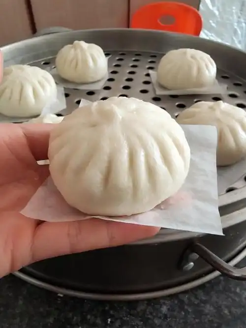 烹饪小爱做的漂亮的提褶包子