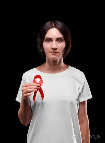 布鲁内特的女性持有红丝带在黑色背景上.艾滋病人的声援