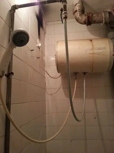 求大神指点这个旧旧的电热水器温度怎么调