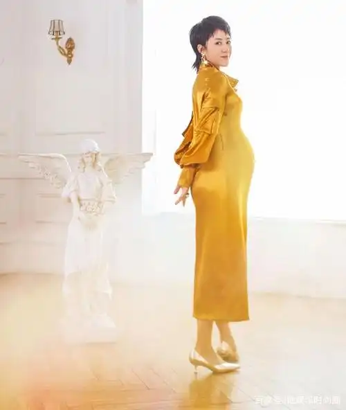 马丽孕肚写真大秀曼妙曲线 只胖肚子不胖四肢美丽大方