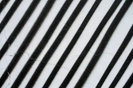 旧混凝土表面有剥落的油漆.墙壁的图形垃圾纹理.抽象背景照片