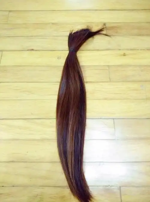 剪掉了齐腰的长发