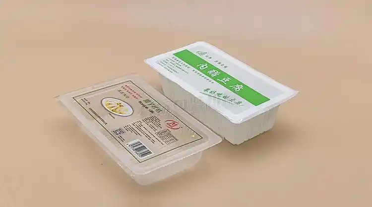 卤水豆腐盒包装机 盒装内酯卤水豆腐封口机 盒式自动封膜机