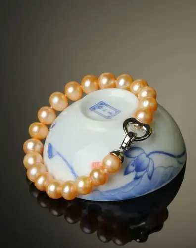 女款四面光粉珍珠手串附证书