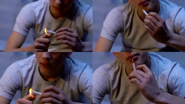 男人在在户外抽烟