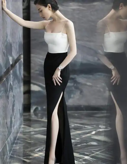 裙子的裙摆是纯黑色的,包臀的设计,将倪妮凹凸有致的身材完全展现