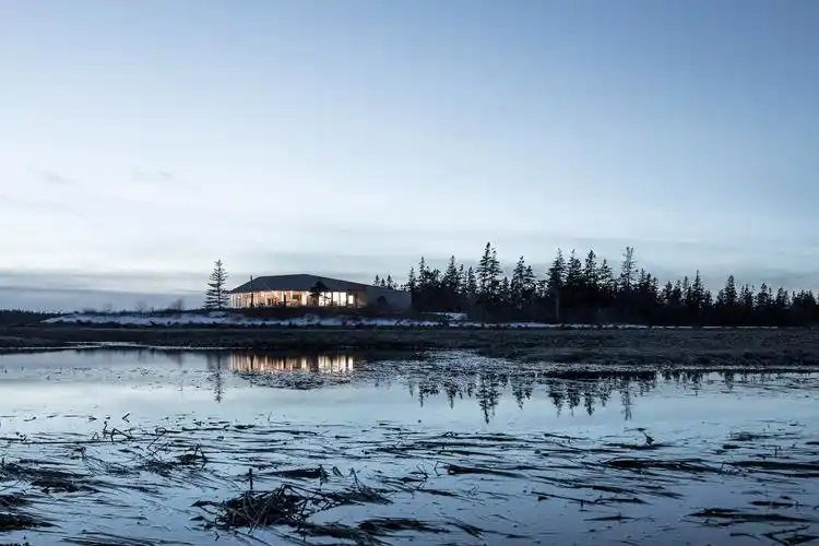 omar gandhi creates low-lying home along rugged