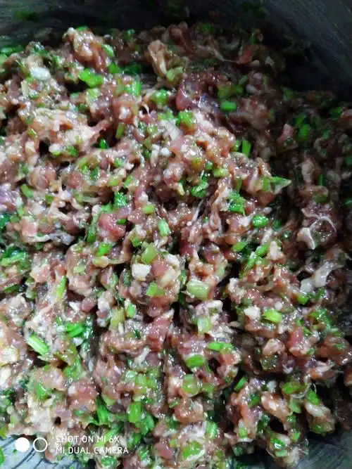 一斤牛肉馅包了57个饺子