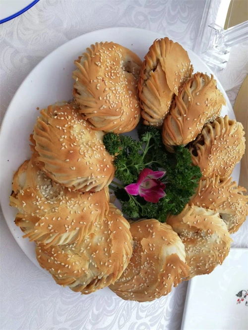 非遗赋能信阳菜:周祖培与商城烧饼