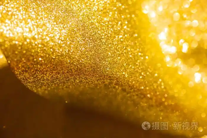 金色闪光圣诞抽象背景.闪亮的金色光芒