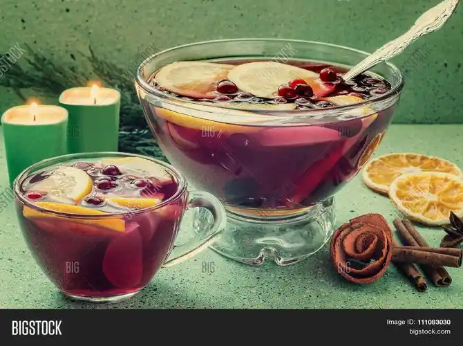 punch - celebratory drink of wine spices and fruits in a bowl