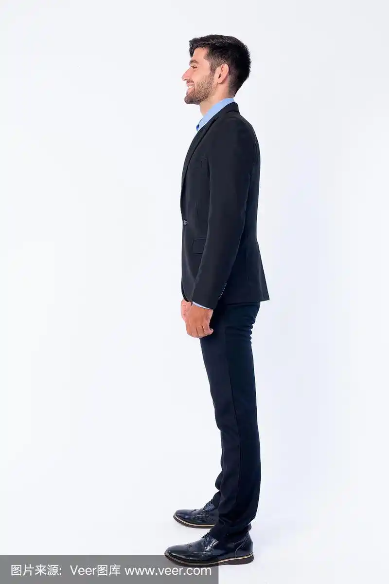 全身照片的侧面视图,快乐的年轻波斯商人胡子微笑