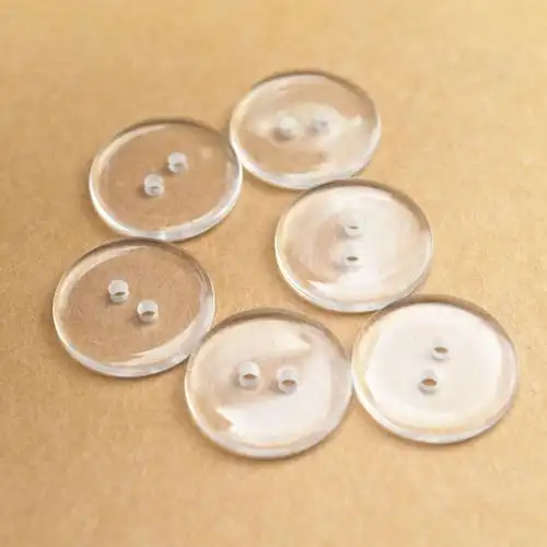 厂家直供服装辅料树脂扣二眼透明面包衬衫毛领纽扣垫扣现货批发