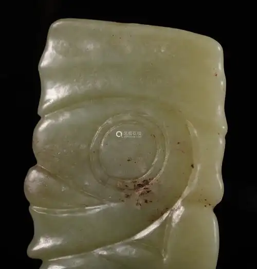 红山人面三孔玉饰