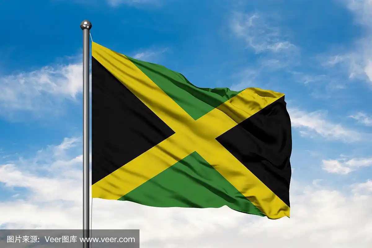 牙买加国旗迎风飘扬,白色多云的蓝天.牙买加国旗.