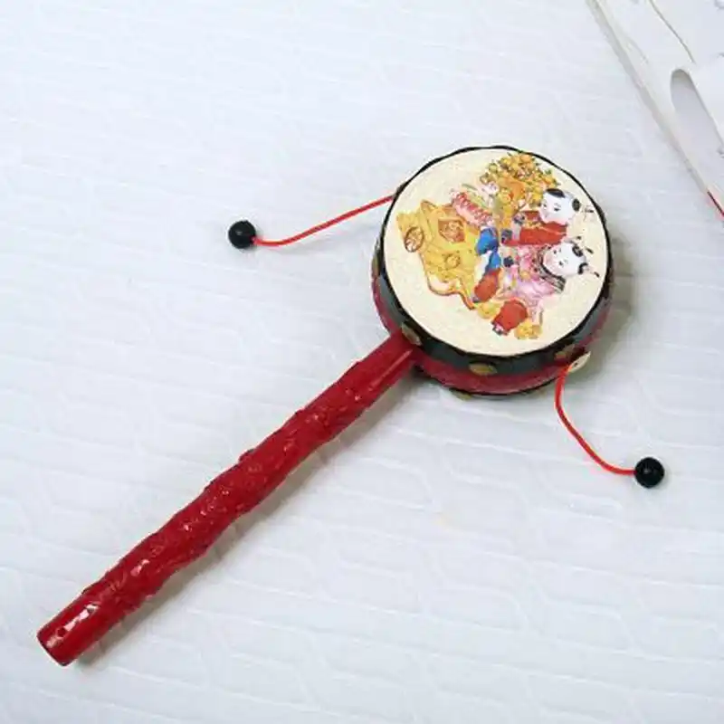 拨浪鼓是一种古老又传统的民间乐器和玩具,出现于战国时期.